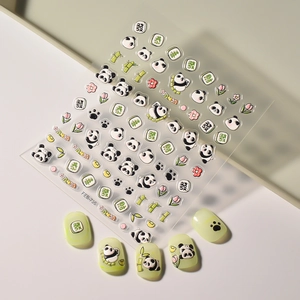 Macro detail of 5D panda nail stickers with bamboo patterns and Chinese characters