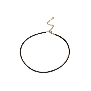 Minimalist black leather choker necklace with gold adjustable chain on white background