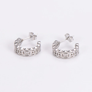 Detailed view of silver hollowed-out copper coin studs with Chinese cultural design
