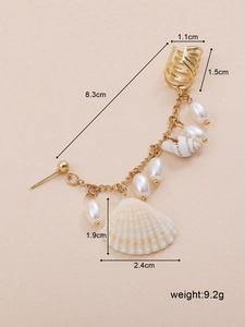 Detailed view of bohemian shell and pearl earring dimensions with gold chain