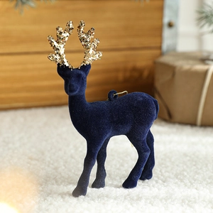 Dark blue flocked reindeer Christmas hanging ornament with gold glitter antlers on plush rug
