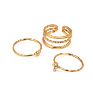 Three-piece gold stainless steel ring set with heart, cross charms and hollow band