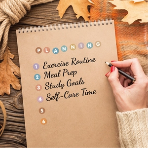 Detailed view of colorful letter dot stickers on a kraft spiral notebook for planning