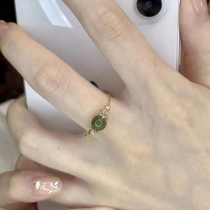 Elegant gold ring with a green jade bead in Neo-Chinese style for women