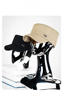 Close-up of military flat top hats with Sports Style metal plates in black and khaki