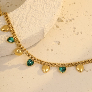 Classic gold stainless steel bracelet with green heart gemstones and gold heart charms