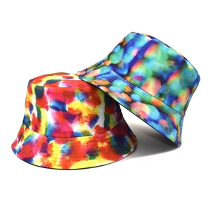 Tie-dye reversible bucket hats in warm and cool watercolor tones for sun protection