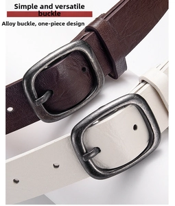 Close-up of leopard print belt alloy buckle with antique silver brushed metal finish
