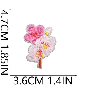 Detailed view of cherry blossom embroidery patch dimensions 4.7cm by 3.6cm on white background