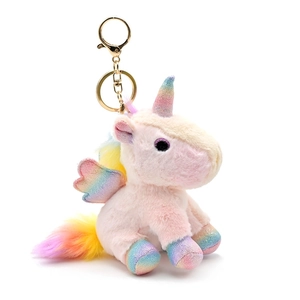 Pink unicorn plush keychain with rainbow wings and gold keyring on white background