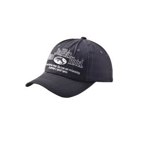Detailed view of white dolphin embroidery on a dark grey washed cotton baseball cap