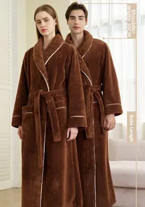 Detail of coral fleece robe showing shoulder measurement 30cm and warm plush fabric texture