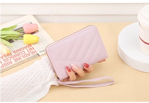 Lavender quilted long wallet for women with zipper closure and matching wristlet strap