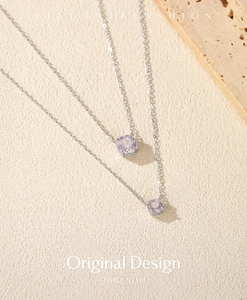 Detail of elegant S925 silver necklaces with lavender octagonal rose-cut stone pendants