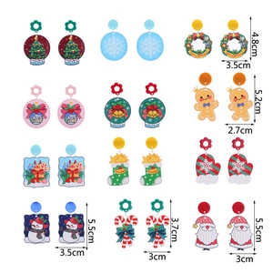Christmas glitter acrylic earrings featuring Santa Claus, snowflakes, and festive trees