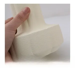 Macro shot of cream ceramic vase showing matte finish and fine grainy texture detail