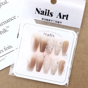 Elegant floral press-on nails set with gradient brown and white daisy art patterns