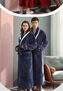 Detail of dark blue flannel bathrobe showing waffle texture and white contrast piping
