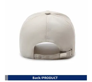 Detail view of the back of a beige cotton baseball cap with adjustable metal buckle strap