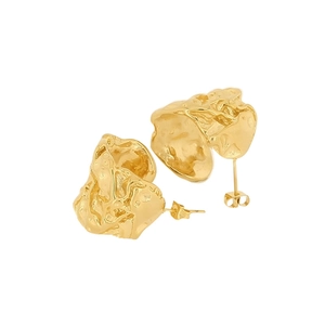 Detailed view of golden irregular pleated C-shaped earrings with molten metal texture