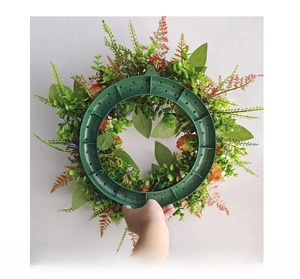 Detail of the green plastic back frame with hook for hanging the autumn pumpkin wreath