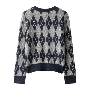 Classic argyle knit sweater with grey, black and navy diamond pattern on white background