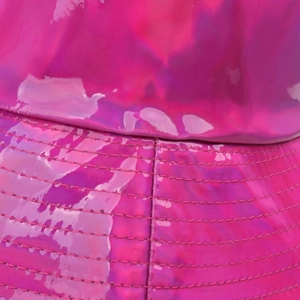 Macro shot of rose red glossy PU leather bucket hat with detailed parallel stitching