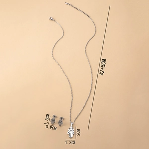 Detailed view of silver Hamsa Hand necklace and earrings set with exact size specifications