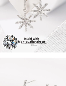 Detailed close-up showing high-quality zircon inlay on snowflake tassel earrings