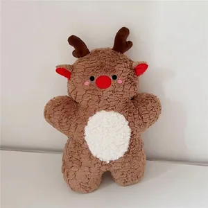Close-up of cute reindeer plush pillow with soft brown teddy fleece and red nose detail