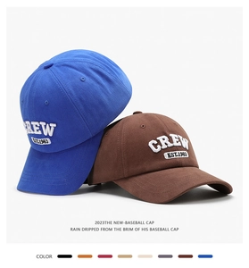 Close-up of 3D embroidered baseball caps with various color swatches and fabric textures