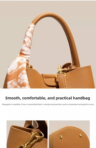 Detailed view of brown lychee grain leather bucket bag with decorative silk scarf handle