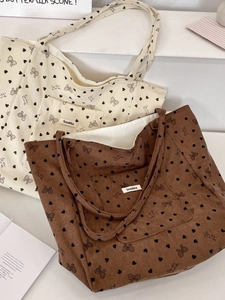 Large corduroy tote bag with heart and bow prints in cream and dark brown colors