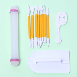 Flat lay of 11pcs fondant tool set with rolling pin and yellow sculpting needles