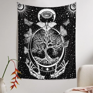 Detail of bohemian black and white tapestry showing Tree of Life and lunar phase pattern