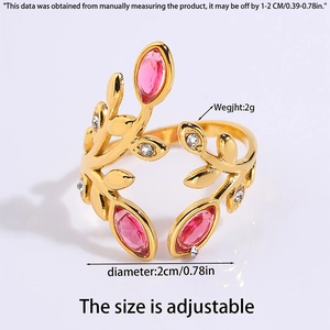 Macro detail of golden leaf branch open ring with pink stones and adjustable size specs