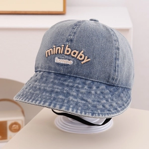 Detailed view of kids denim bucket hat with mini baby 3D embroidery and chin strap