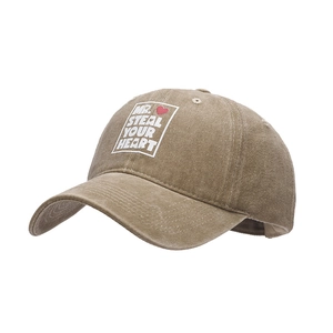 Washed khaki baseball cap with MR. STEAL YOUR HEART print and red heart detail