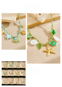 Detail of bohemian ocean charms including starfish and turtle on rainbow braided cords