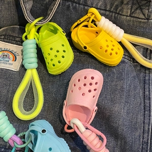 Colorful mini hole shoe keychains in yellow, green, pink, and blue with climbing buckles
