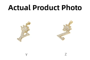 Close-up of gold hip hop pendants with letters Y and Z featuring crowns and micro-set zircon