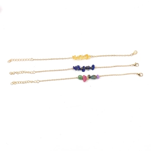 Three gold chain bracelets with irregular natural crystal stones in various colors