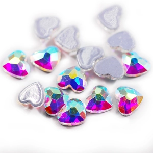 Detailed macro view of heart-shaped AB crystal rhinestones with silver flatback