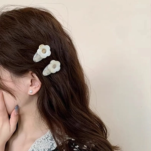 Minimalist cream flower hair clips set of two for women showing natural side wear style