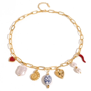 Gold chain necklace with pearl heart and shell pendants on a clean white background