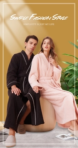 Detail of warm flannel robes for couples with white piping and waist belt closure