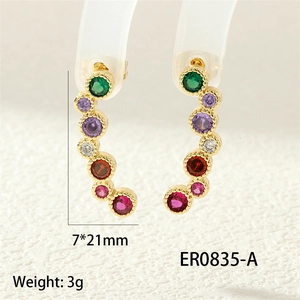 Macro shot of colorful curved zircon earrings with dimensions 7x21mm and weight of 3g