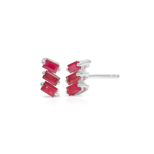 Detailed macro view of silver stud earrings with three tiered rectangular red zircon stones