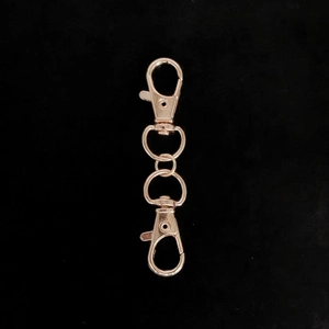 Detail of rose gold alloy swivel lobster clasp connector for DIY keychain accessories