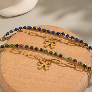 Vintage lapis lazuli beaded bracelet with 18K gold plated bow charm and toggle clasp